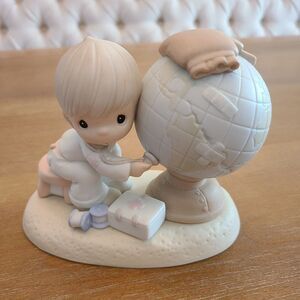 Precious Moments 1992 Jesus is the Answer figurine.